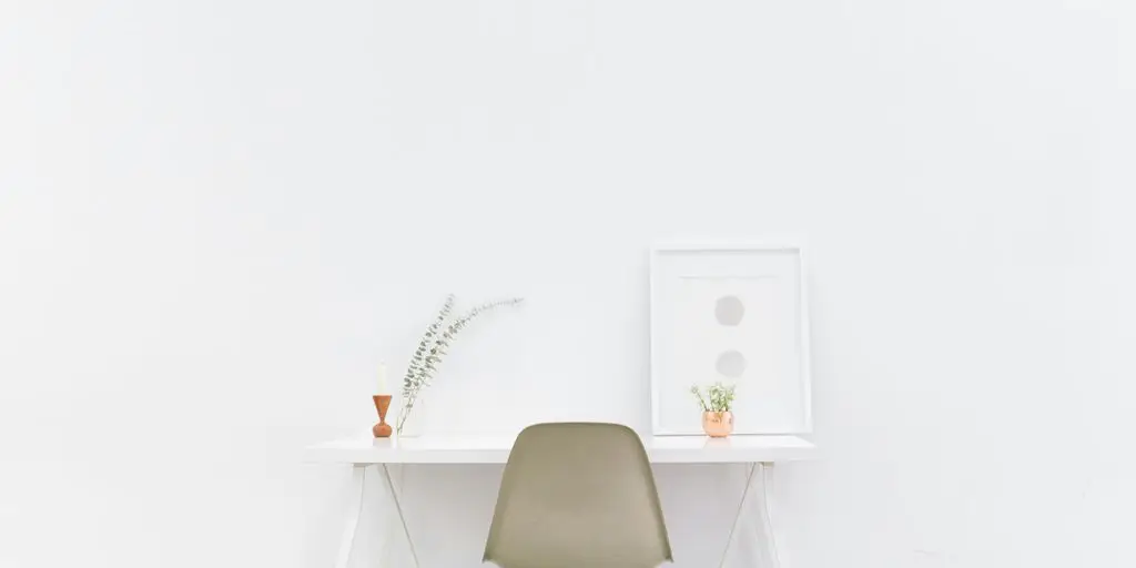 white wooden table near brown chair